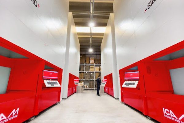 MAXI T automated tower storage for panels and sheet metal, feeding a laser cutting cell. MAXI T automated tower storage for panels and sheet metal, feeding a laser cutting cell.